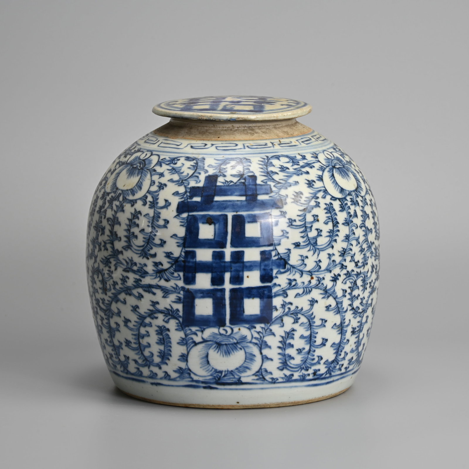 A CHINESE BLUE AND WHITE PORCELAIN 'SHUANGXI' PORCELAIN JAR AND COVER, 19TH CENTURY.: A CHINESE BLUE AND WHITE PORCELAIN 'SHUANGXI' PORCELAIN JAR AND COVER, 19TH CENTURY. Decorated with Double Happiness characters on a sweet pea pattern ground, the cover matching in decoration. 20cm ta