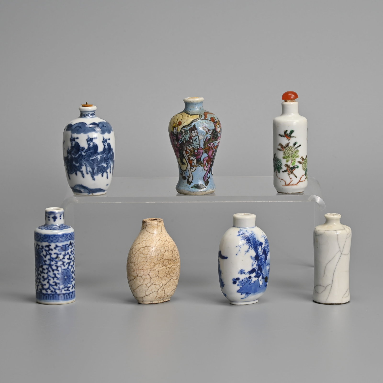 A GROUP OF CHINESE PORCELAIN SNUFF BOTTLES, 19/20TH CENTURY.: A GROUP OF CHINESE PORCELAIN SNUFF BOTTLES, 19/20TH CENTURY. To include a blue and white ovoid bottle decorated with figures on horseback, six character mark of Yongzheng to base; A blue and white fla