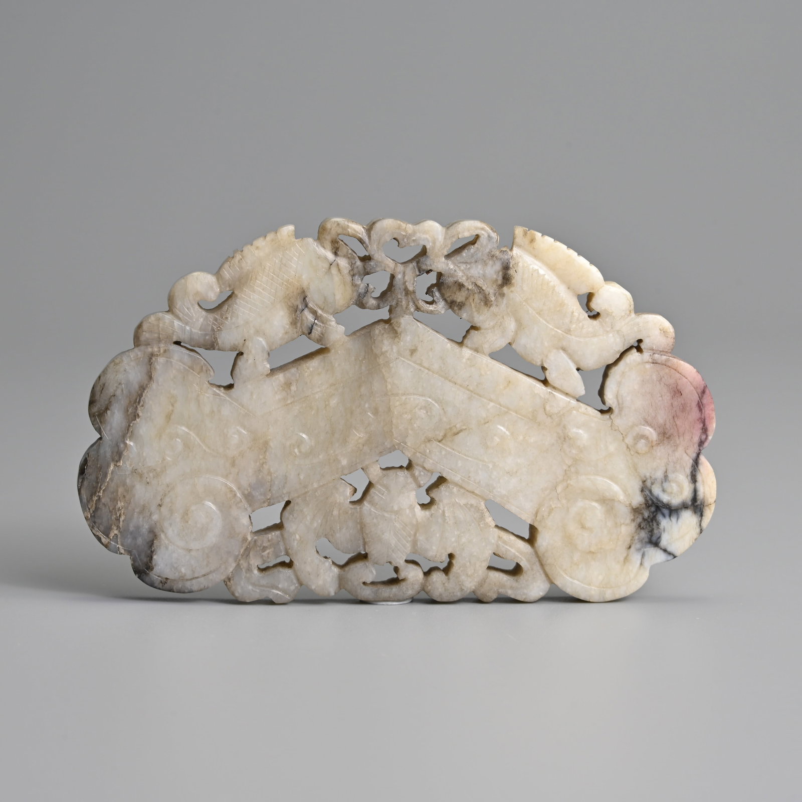 A CHINESE CARVED GREYISH JADE RUYI SHAPED 'CHIME' PENDANT, 19TH CENTURY. (1 of 4)