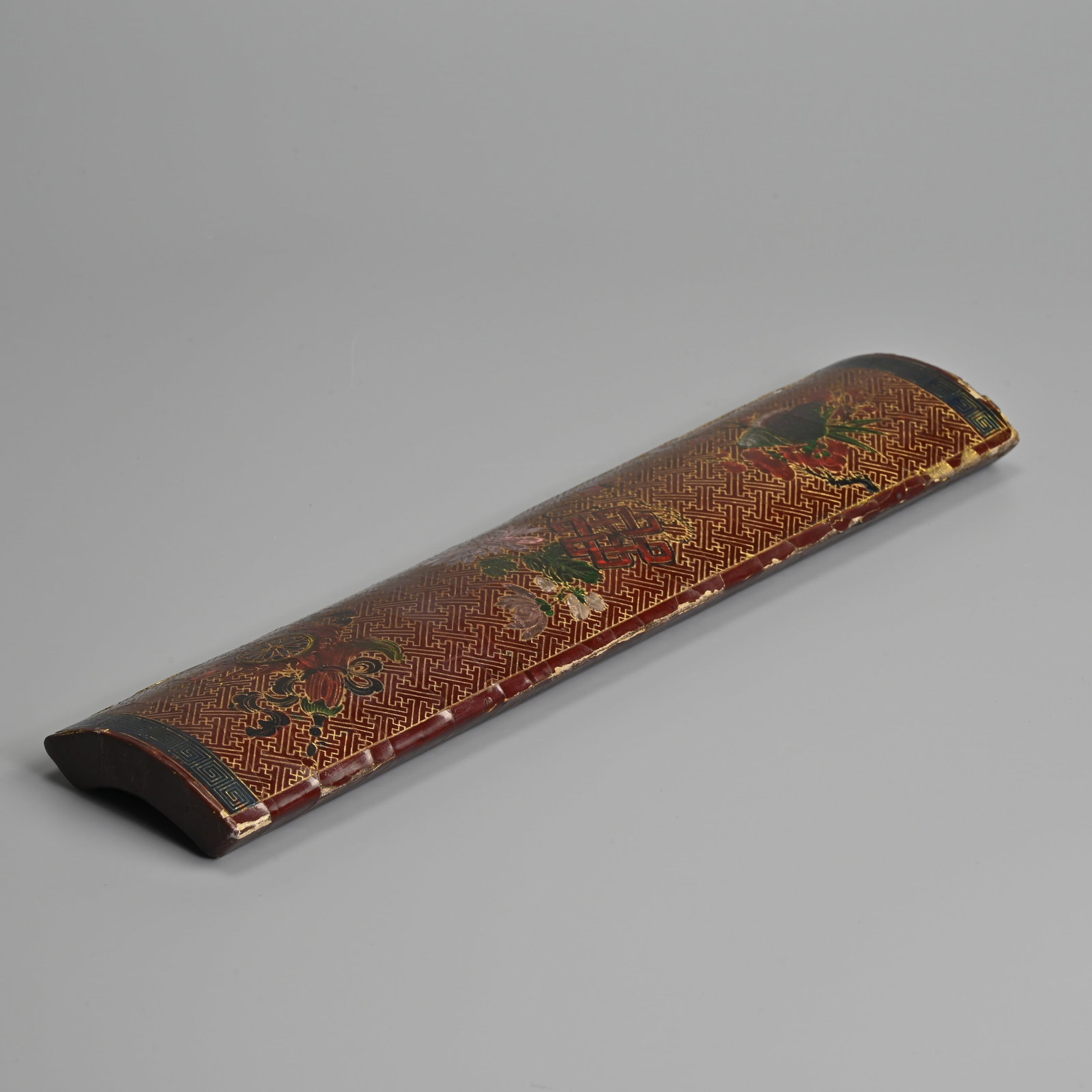 A CHINESE LACQUER WRIST REST WITH INSCRIPTION, APOCRYPHAL QIANLONG YUZHI MARK. (1 of 7)