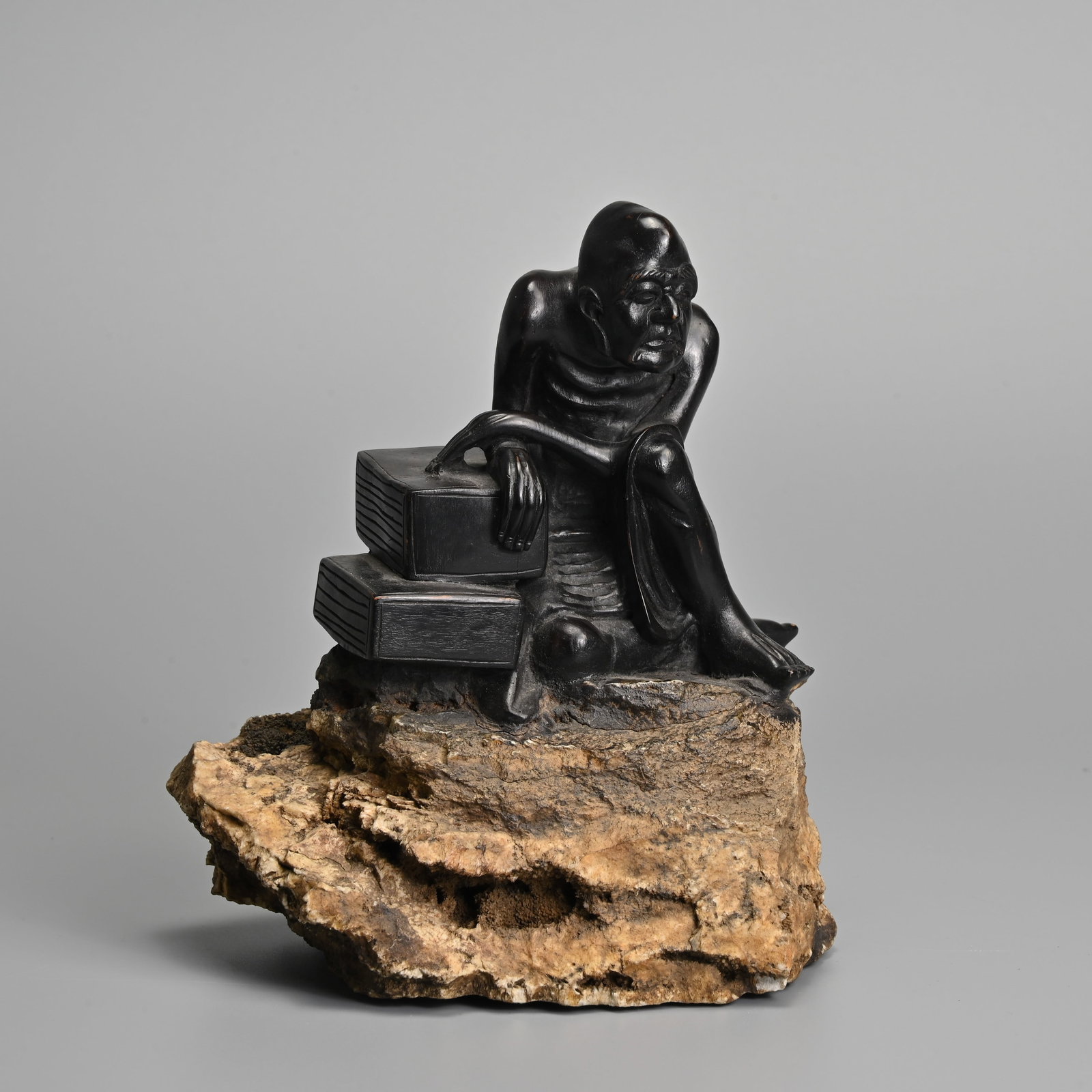 A CHINESE CARVED HARDWOOD FIGURE ON STONE BASE, 20TH CENTURY. (1 of 6)