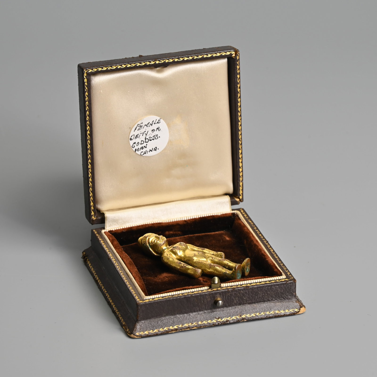 A SMALL GILT BRONZE EFFIGY, 18TH CENTURY OR EARLIER.: A SMALL GILT BRONZE EFFIGY, 18TH CENTURY OR EARLIER. The male figure standing with arms down to his side. 5.7cm tall. Weight 38.9 grams.