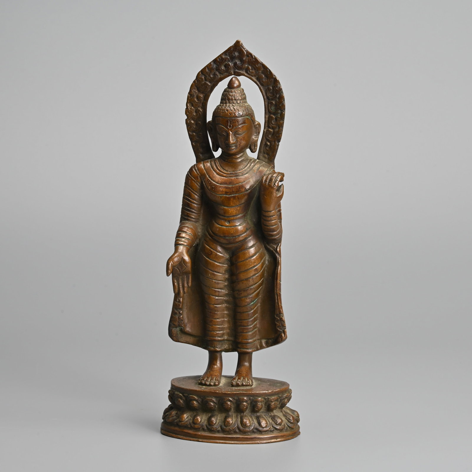 A STANDING BRONZE FIGURE OF BUDDHA SHAKYAMUNI, PROBABLY NEPAL, 19/20TH CENTURY. (1 of 7)