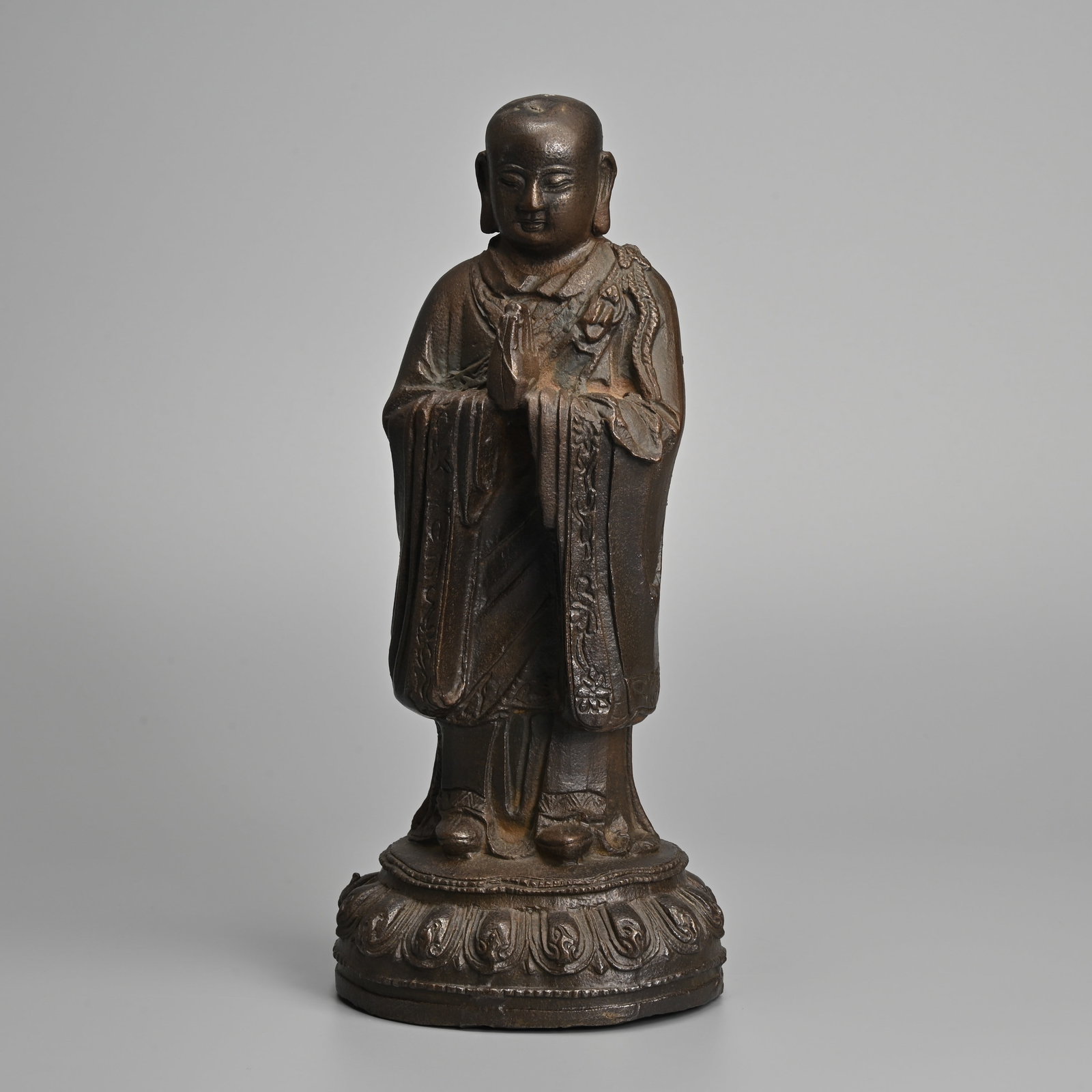 A CHINESE CAST IRON FIGURE OF A LUOHAN OR MONK, 19TH CENTURY. (1 of 8)