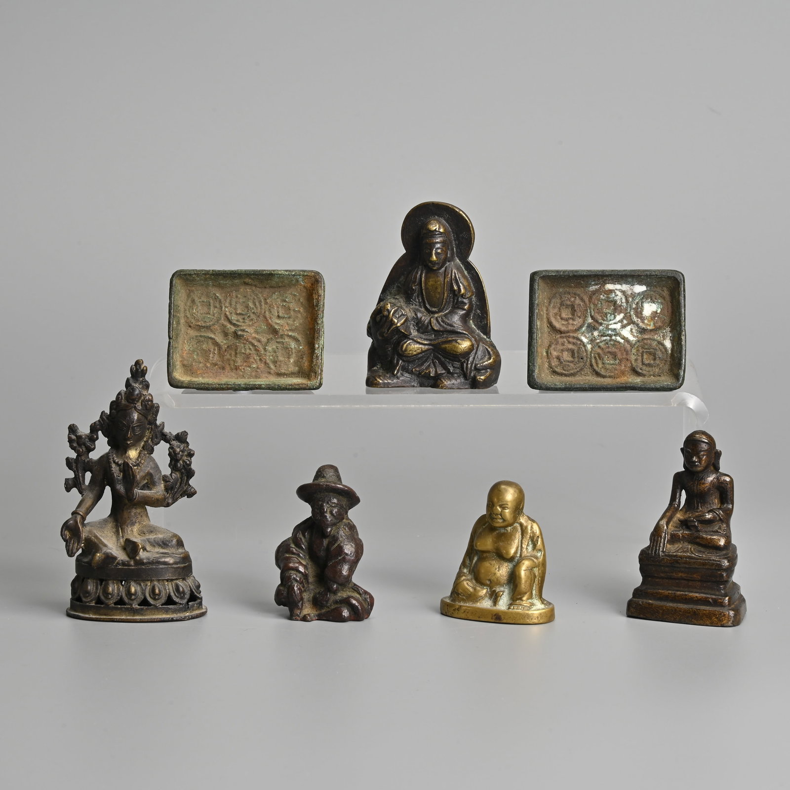 A GROUP OF CHINESE, SOUTHEAST ASIAN, TIBETAN BRONZE FIGURES, SEAL AND COIN MOULDS, 19/20TH CENTURY. (1 of 17)