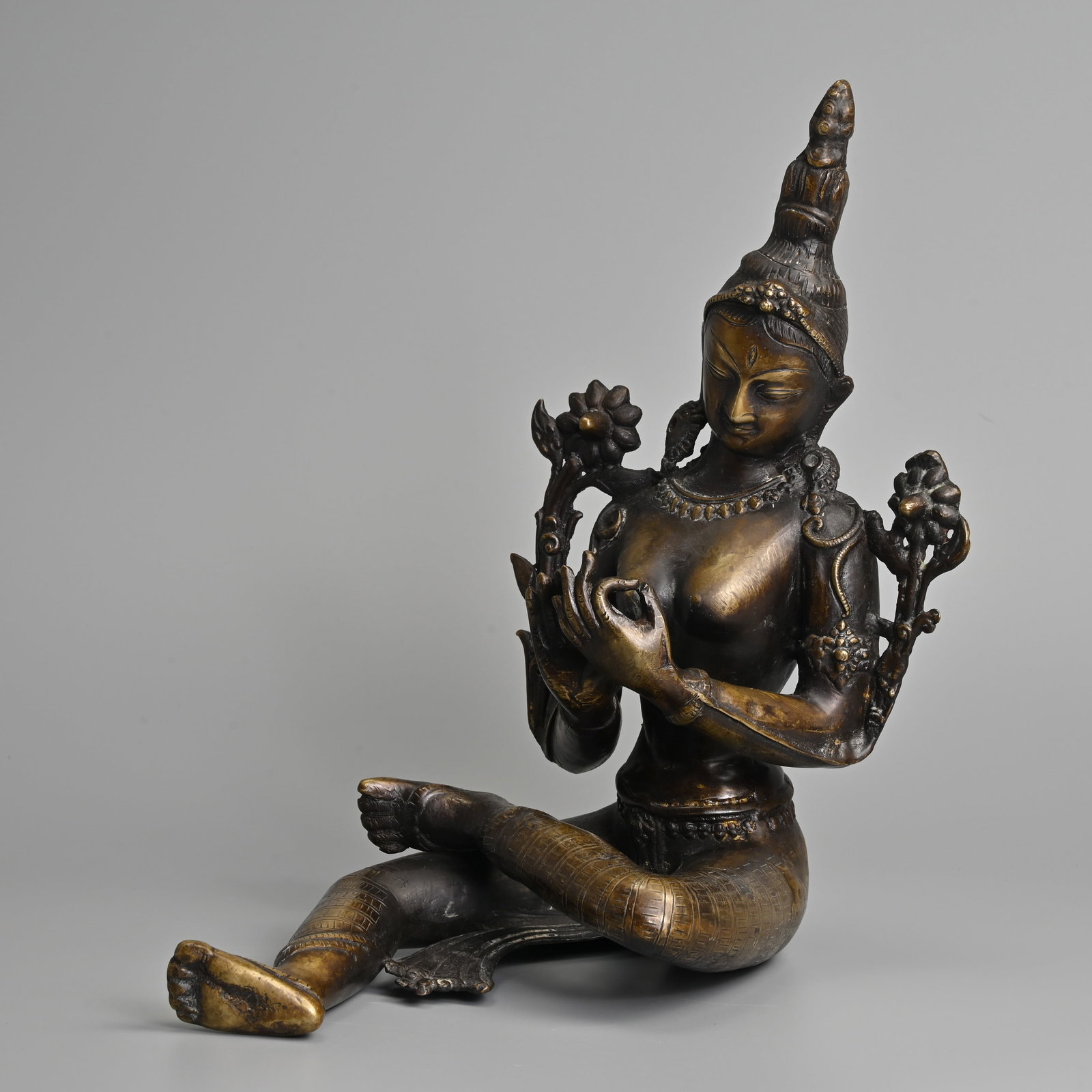 A BRASS BUDDHIST FIGURE OF GREEN TARA, TIBETAN OR NEPALESE, 20TH CENTURY. (1 of 9)