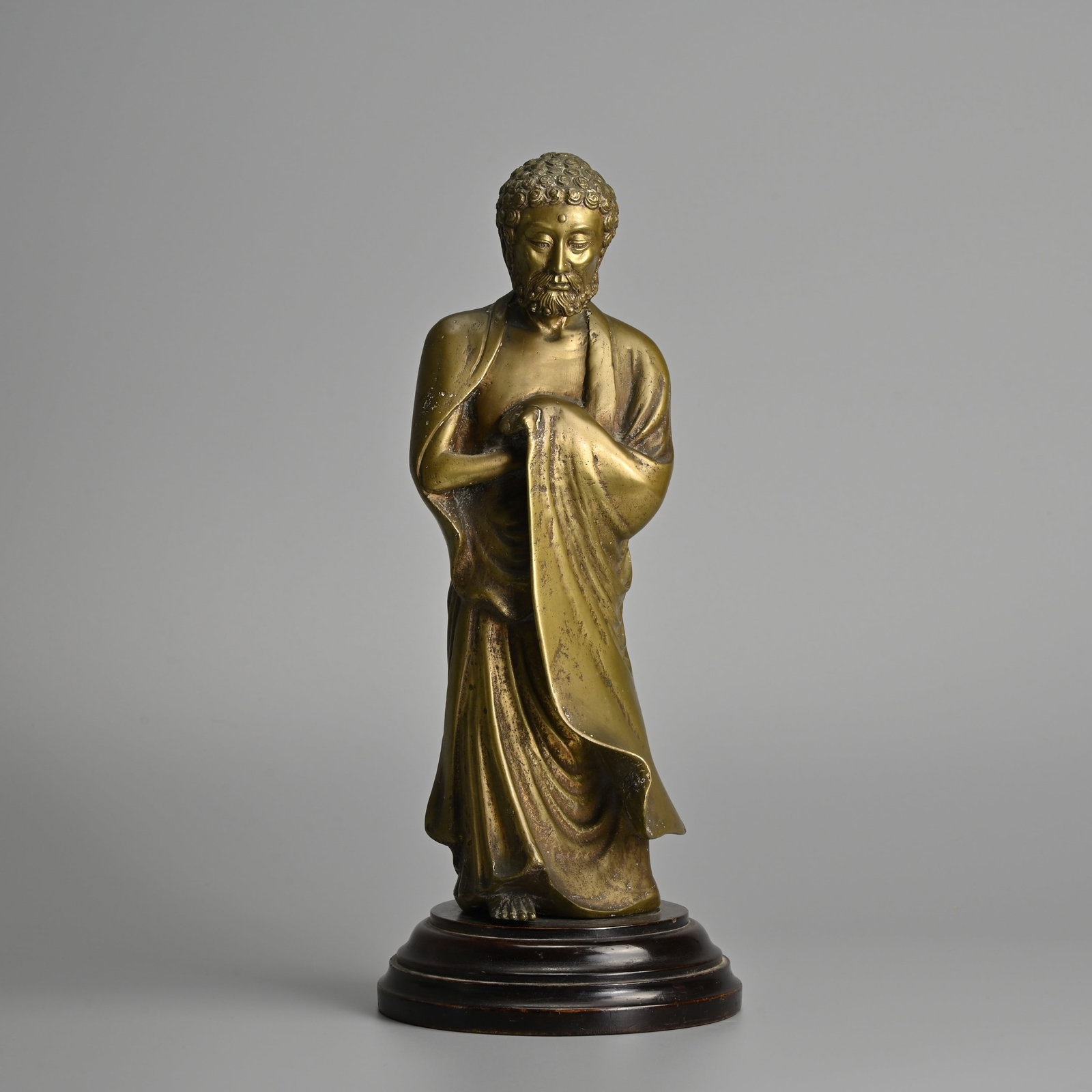 A CHINESE POLISHED BRONZE FIGURE OF A LUOHAN, BODHIDHARMA, 19TH CENTURY. (1 of 7)