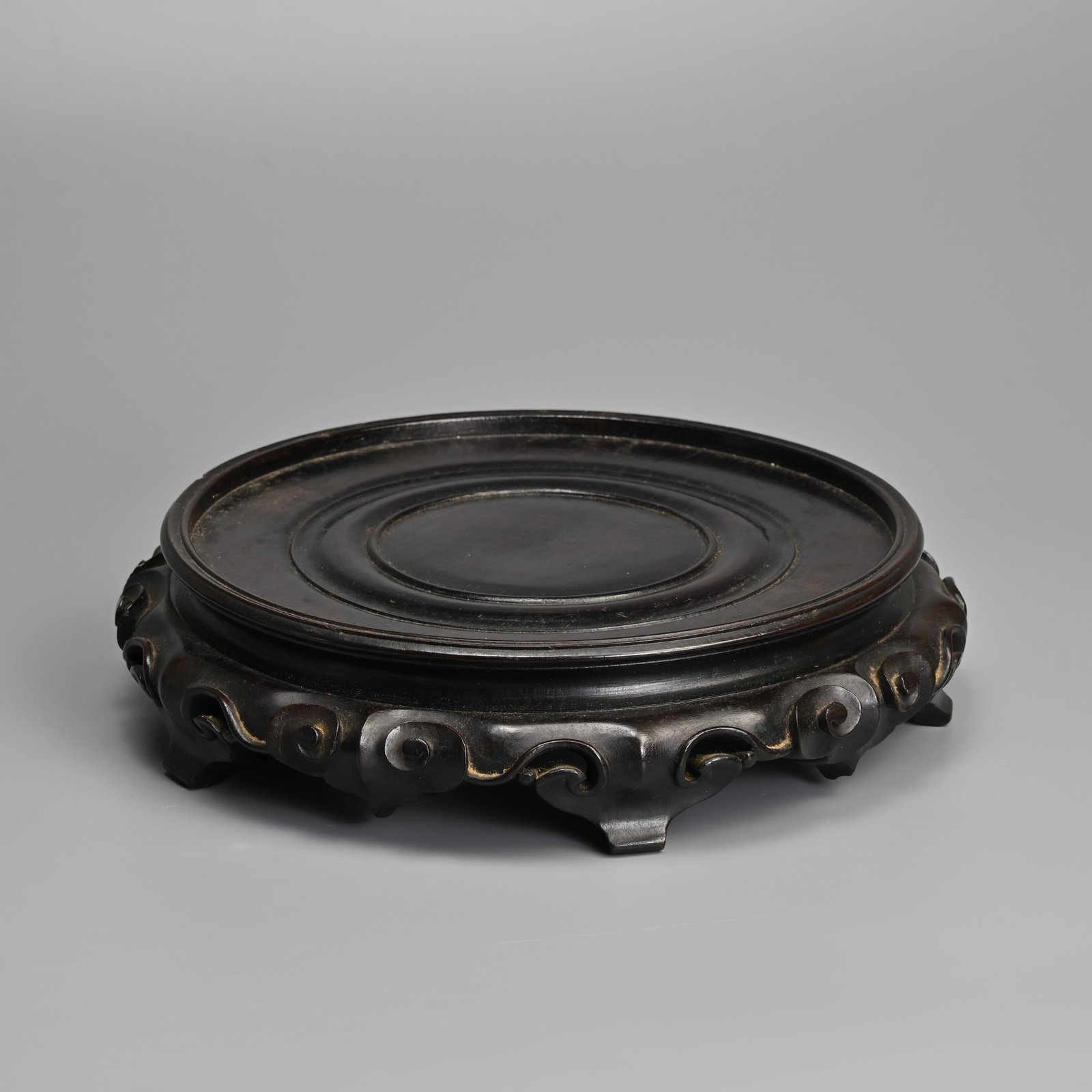 A CHINESE CARVED HARDWOOD 'XUANJI' DISPLAY STAND, QING DYNASTY. (1 of 8)