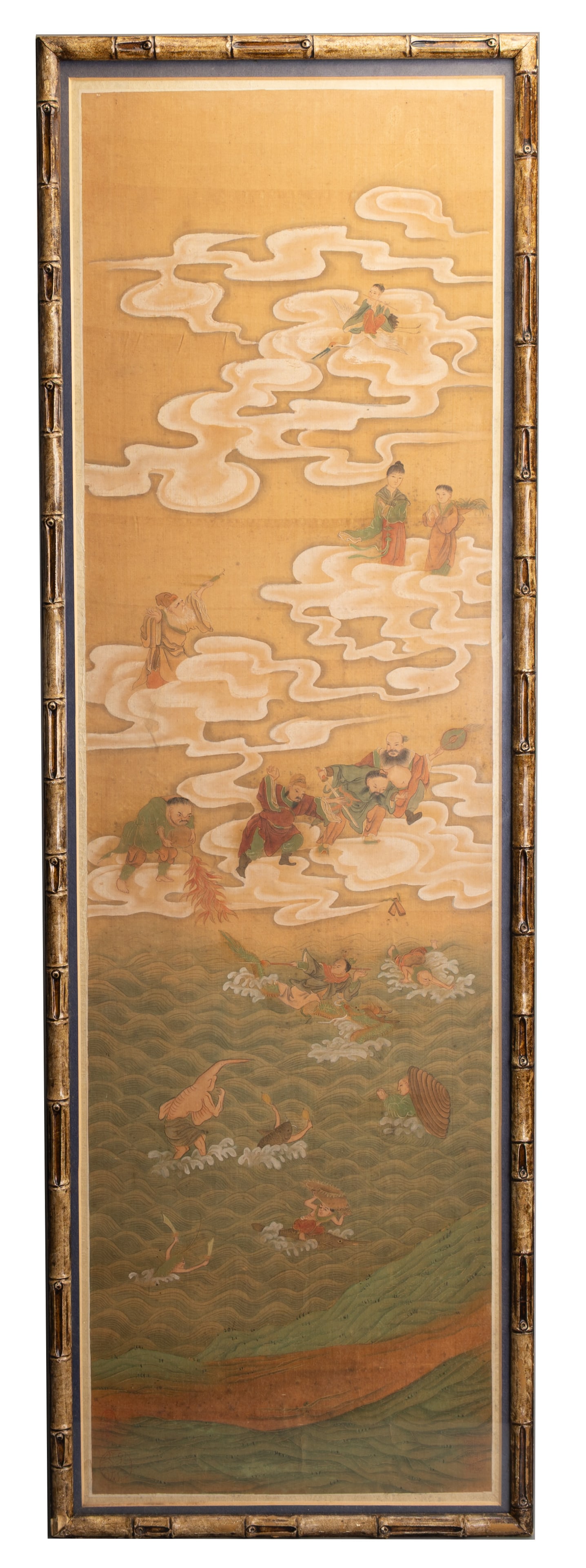 A CHINESE FRAMED SILK PAINTING OF THE EIGHT IMMORTALS, EARLY 20TH CENTURY.: A CHINESE FRAMED SILK PAINTING OF THE EIGHT IMMORTALS, EARLY 20TH CENTURY. Ink and colour on silk depicting immortals on clouds looking down at mythical sea creatures, fish spirits and dragons swimmin
