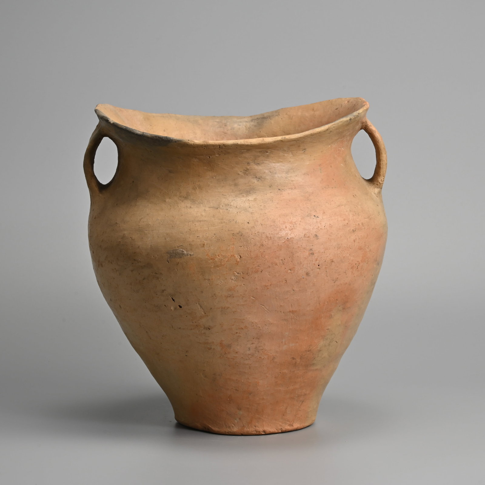 A LARGE CHINESE NEOLITHIC RED POTTERY 'SADDLE MOUTH' HANDLED JAR, SIWA CULTURE, QINGHAI OR GANSU (1 of 6)