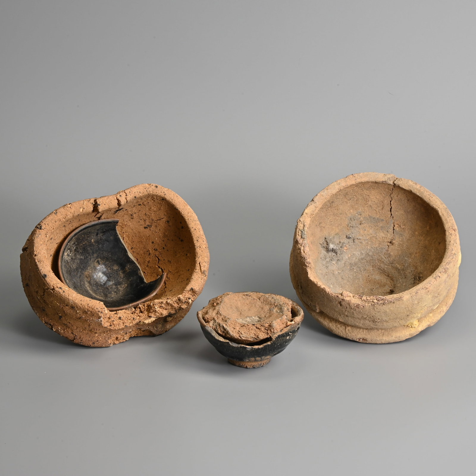 TWO CHINESE JIAN HARE'S FUR GLAZED POTTERY TEA BOWLS WITH KILN SAGGARS, SONG DYNASTY (960-1279). (1 of 6)
