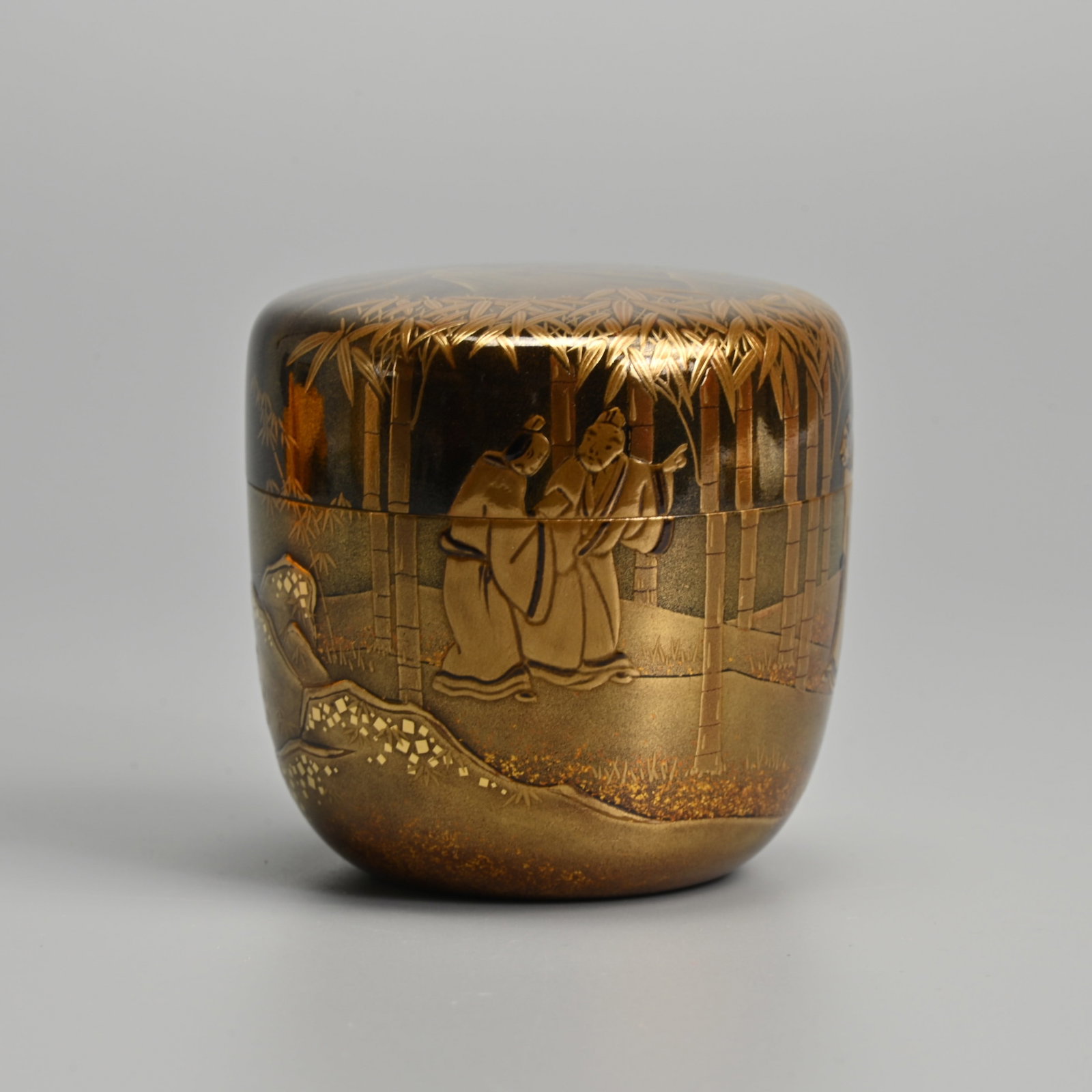 A FINE JAPANESE LACQUER TEA CADDY, NATSUME, BY KAZUNORI TANIUCHI (SHIKO B.1956), LATE 20TH CENTURY.: A FINE JAPANESE LACQUER TEA CADDY, NATSUME, BY KAZUNORI TANIUCHI (SHIKO B.1956), LATE 20TH CENTURY. Black lacquered with gold maki-e decoration featuring The Seven Sages of Bamboo Grove. Together with