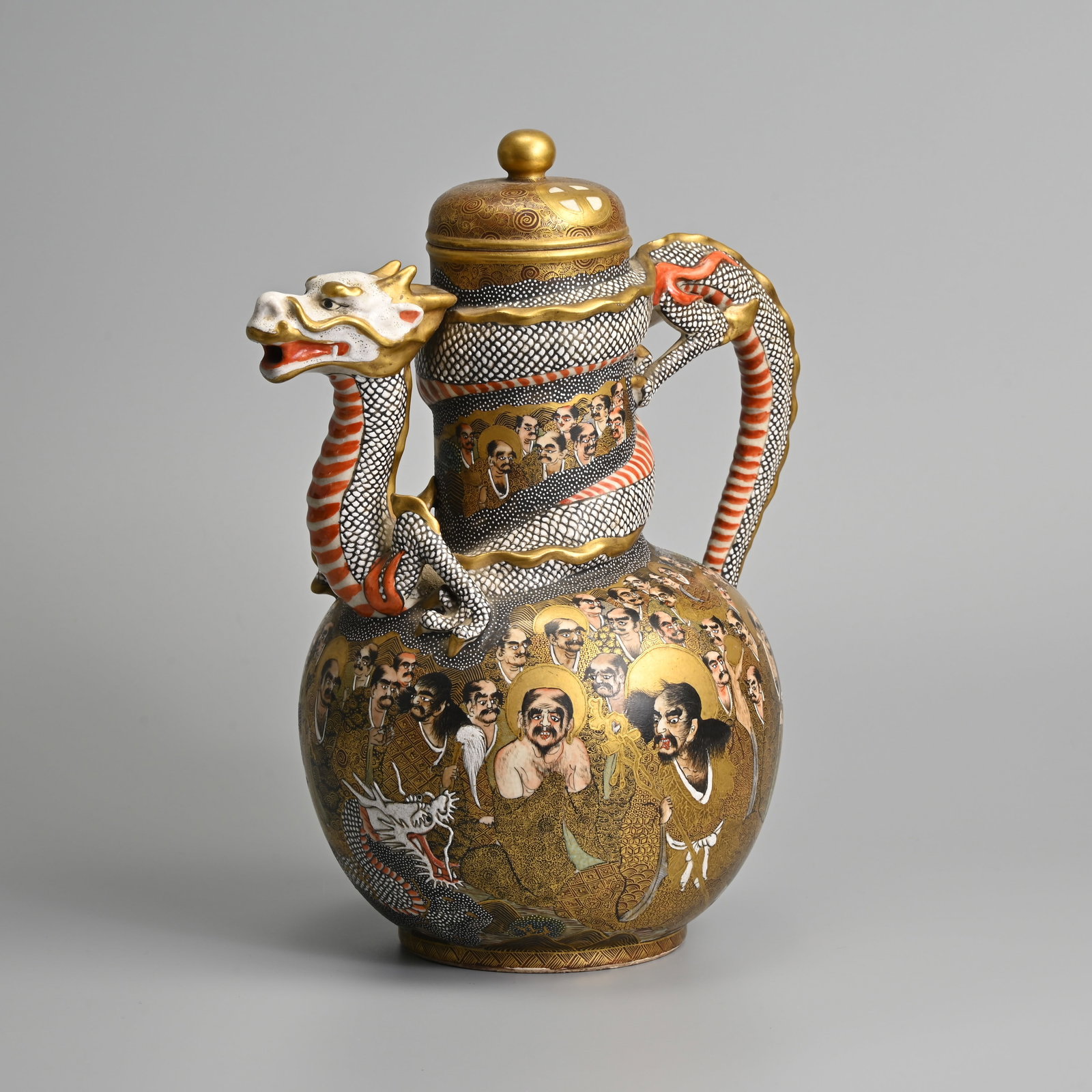 A LARGE JAPANESE SATSUMA WARE 'THOUSAND FACES' DRAGON EWER AND COVER, MEIJI PERIOD. (1 of 13)