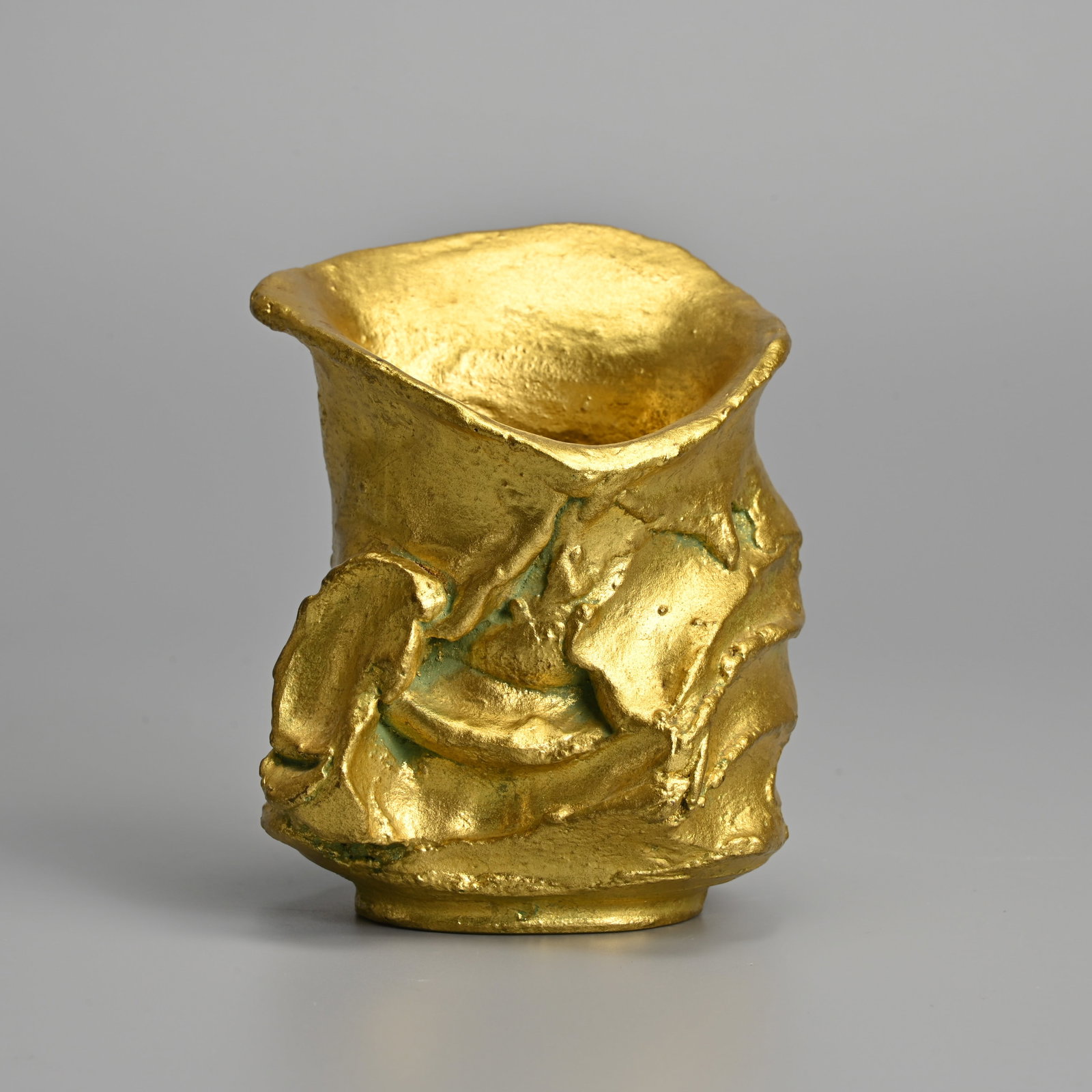 A JAPANESE CONTEMPORARY BRONZE GOLD HIGHLIGHTED VASE, 'MYTH', MASUO IKEDA (1934-1997).: A JAPANESE CONTEMPORARY BRONZE GOLD HIGHLIGHTED VASE, 'MYTH', MASUO IKEDA (1934-1997). Signed ?Masuo?. 10cm tall, weight: 0.95kg.