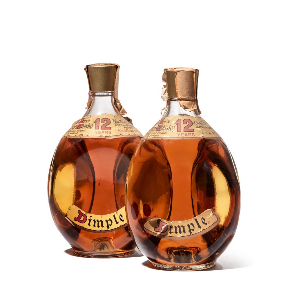 Dimple Haig 12 Year Old 1960s and 70s: 5 bottles Dimple Haig 12 Year Old Believed 1960s and 1970s One bottled believed 1960s, four believed 1970s. One bottle with spring capsule. Slightly discoloured labels. Levels: four 2 cms and one 4cms
