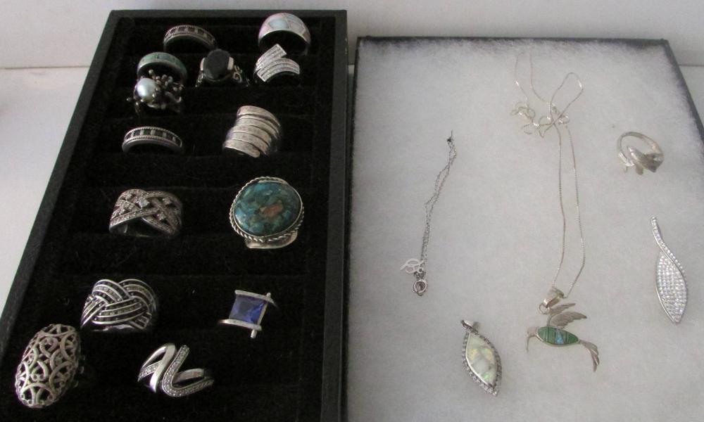 Approximately 20 Pieces of Sterling Jewelry 4 ozs.: The lot weighs 4 ounces and includes rings sizes 6 to 8, necklace, pendants, some with semi precious stones and marcasite, etc. Check the photos.