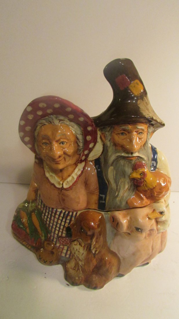 Sgd Roseville OH Wihoa: Signed on the bottom and on the back of the cookie jar which measures 10" long and 12" tall and is in very good condition. Design is a farmer, his wife, a pig, a dog, and a duck. Signed also on the bo