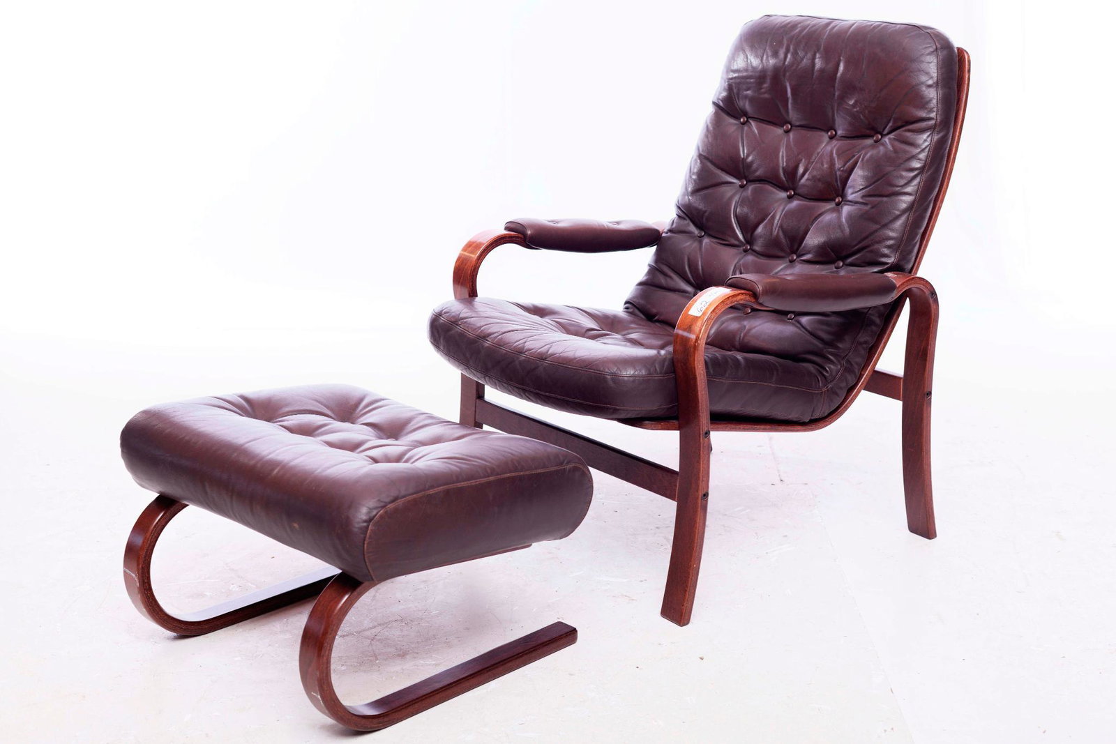 Mid century leather upholstered armchair and footstool: 35" tall x 26" wide