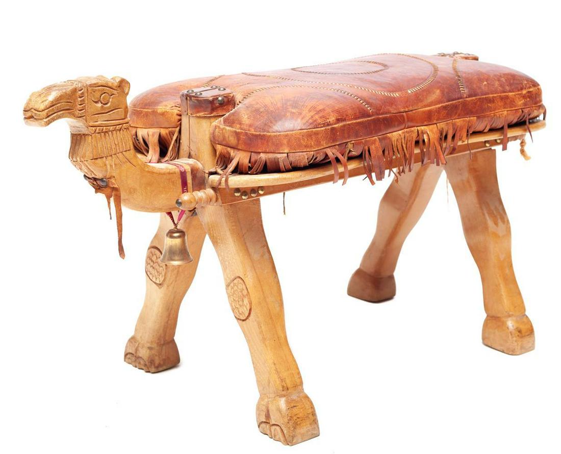Unique carved camel-form leather upholstered saddle: 19" tall x 34" wide