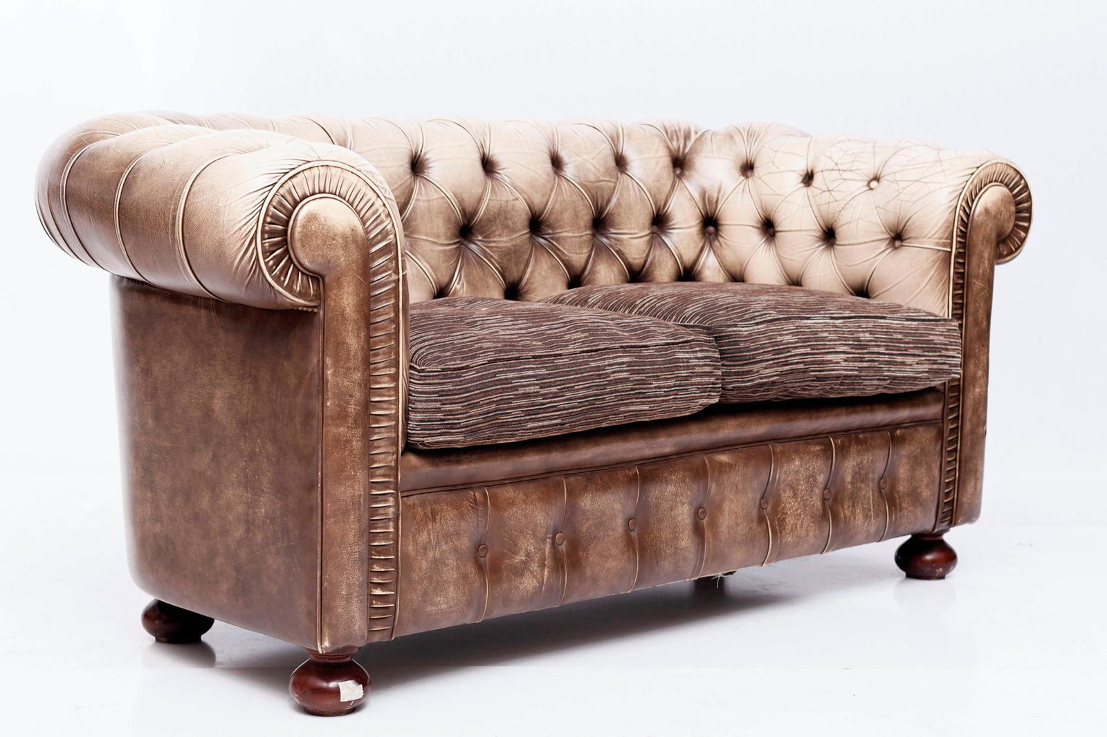 Chesterfield-style leather upholstered loveseat: 33 tall x 69 long