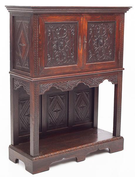 Renaissance-style oak bonnetiere cabinet: 58" tall x 46" wide x 18" deep
