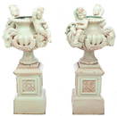 Pair of Early Cast Iron Jardinieres with Cherub Mounts