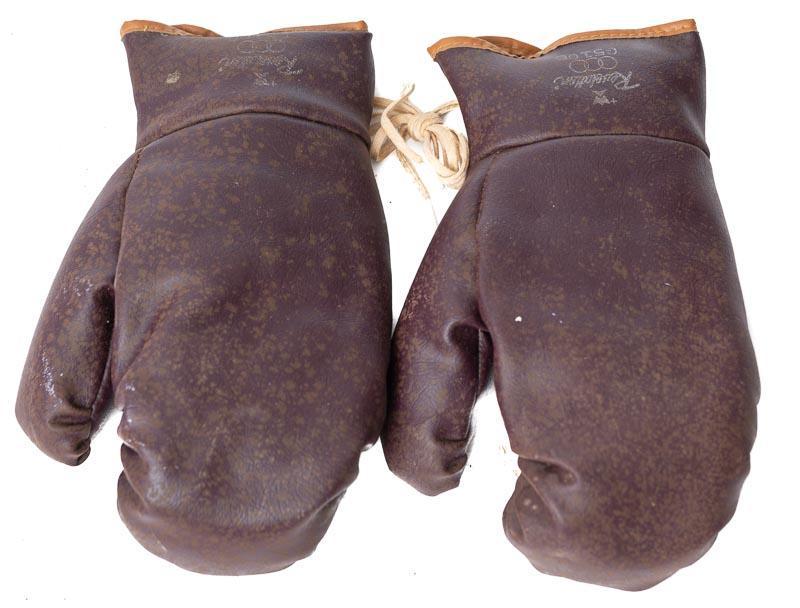 Pair of Vintage Leather Boxing Gloves: Provenance: A Minnetonka, MN Estate Both gloves are left-handed 11" long