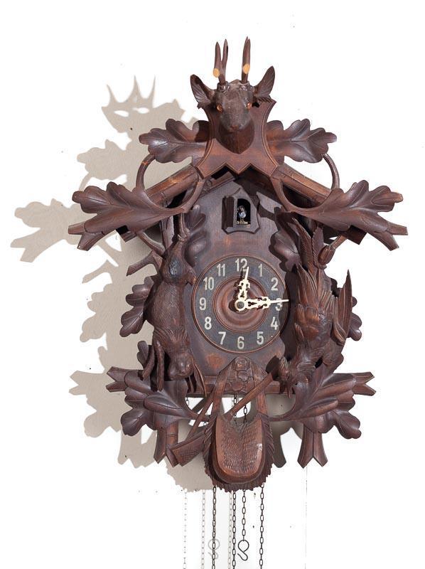 Cuckoo Wall Clock with Brass Plate Movement: Condition: broken antlers 24" tall x 17.5" wide Provenance: The Estate of Andy and Bea Copeland Note: This antique clock is sold "where-is, as-is" and Vogt Auction makes no guarantee as to the working