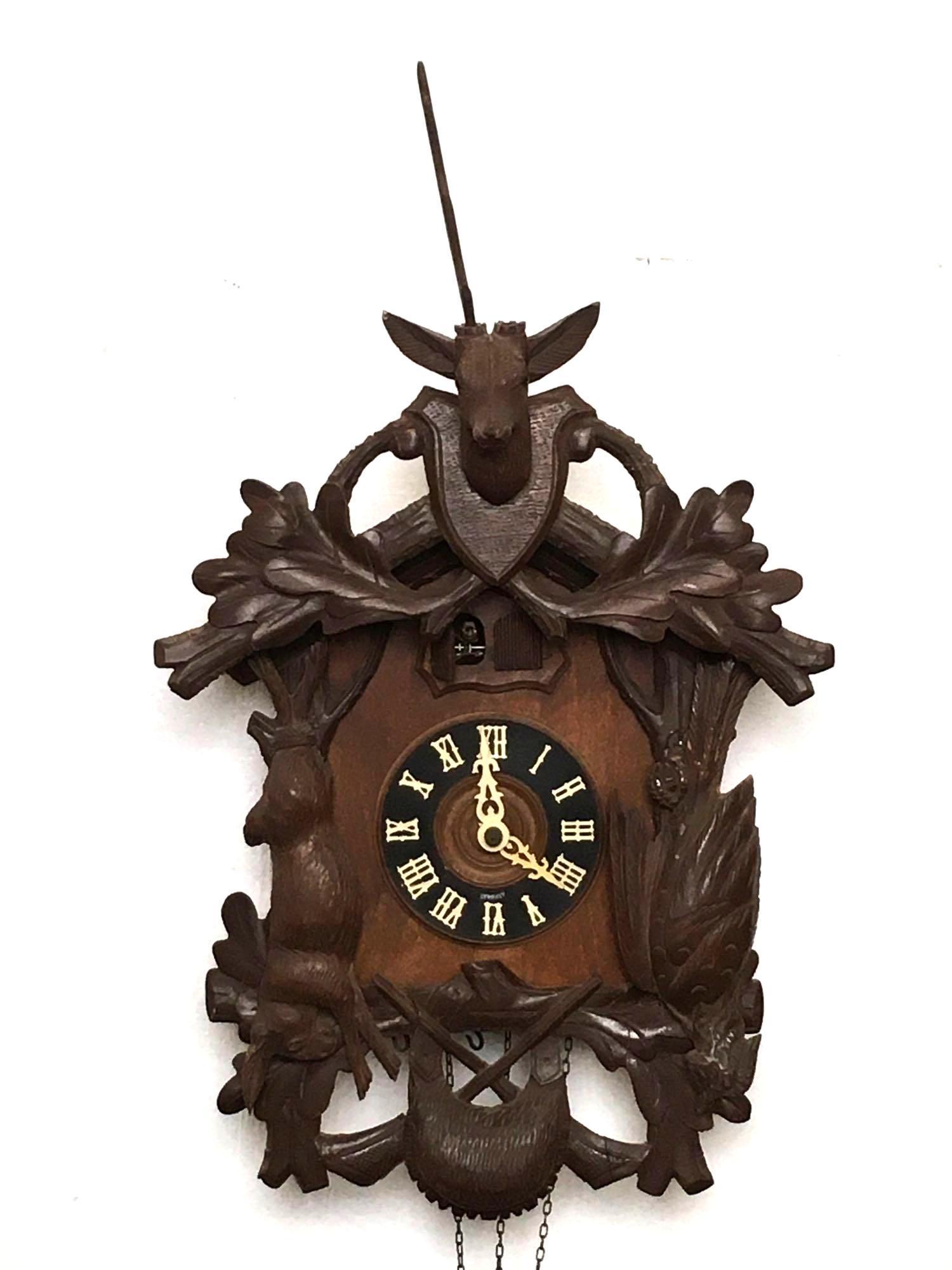 Cuckoo and Quail Wall Cock with Brass movement: Condition: Broken antler 25" tall x 15" wide Provenance: The Estate of Andy and Bea Copeland Note: This antique clock is sold "where-is, as-is" and Vogt Auction makes no guarantee as to the working or