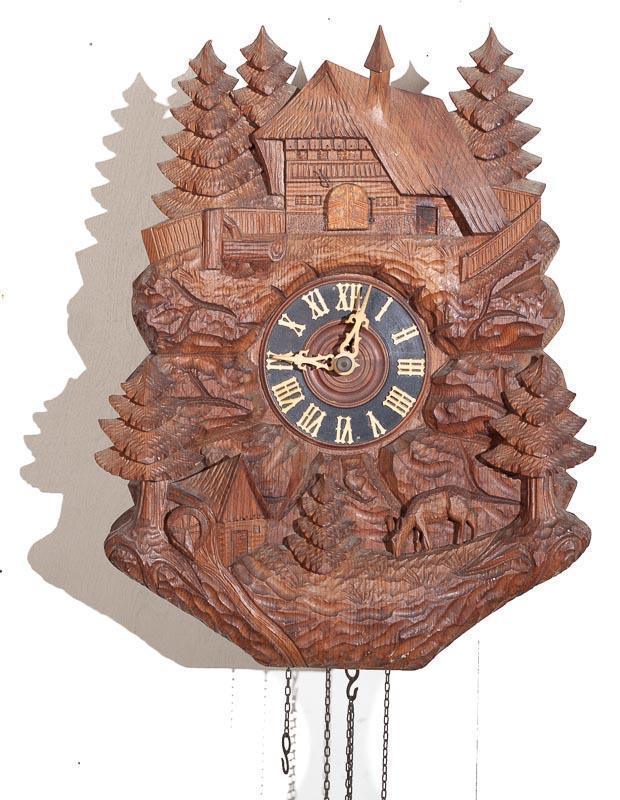 Cuckoo Wall Clock with Brass Movement: 15" tall x 12" wide Provenance: The Estate of Andy and Bea Copeland Note: This antique clock is sold "where-is, as-is" and Vogt Auction makes no guarantee as to the working order or completeness of th