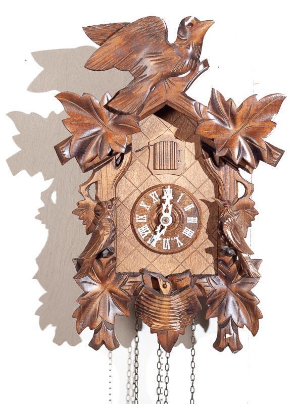 Cuckoo Wall Clock with Brass Movement: 14" tall x 10" wide Provenance: The Estate of Andy and Bea Copeland Note: This antique clock is sold "where-is, as-is" and Vogt Auction makes no guarantee as to the working order or completeness of th