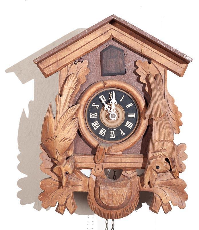 Figural Cuckoo Wall Clock with Brass Movement: Condition: Missing top 13.5" tall x 10" wide Provenance: The Estate of Andy and Bea Copeland Note: This antique clock is sold "where-is, as-is" and Vogt Auction makes no guarantee as to the working or