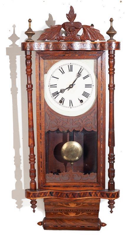 Anglo-American Wall Clock, 8 Day Time and Strike: 15" tall x 12.5" wide Provenance: The Estate of Andy and Bea Copeland Note: This antique clock is sold "where-is, as-is" and Vogt Auction makes no guarantee as to the working order or completeness of 