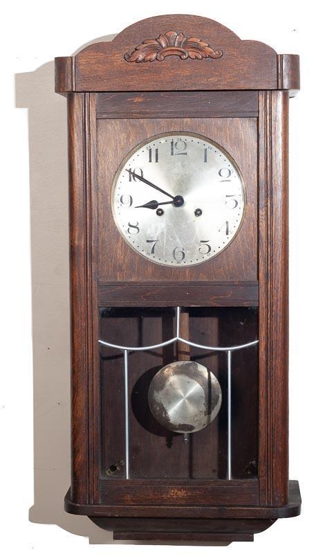 German Box Clock: Provenance: The Estate of Andy and Bea Copeland 31" tall x 15" wide Note: This antique clock is sold "where-is, as-is" and Vogt Auction makes no guarantee as to the working order or completeness of th