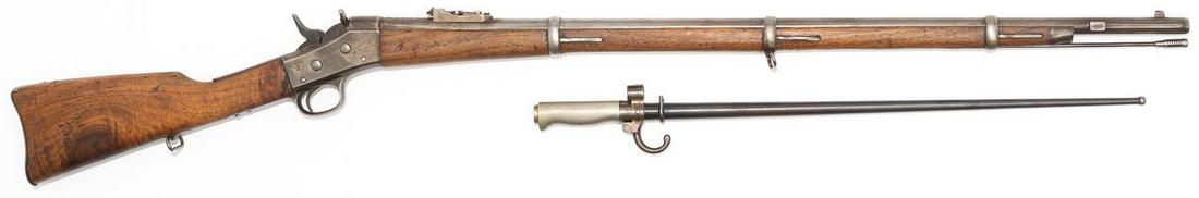 Remington Rolling Block Rifle with French Bayonet: Serial: Manufacturer: Remington Model: Caliber: Unknown Barrel length: 35" Condition: Fair; worn finish With French Lebel bayonet Provenance: The Estate of Dr. Thomas Romo, Jr. (San Antonio, Tex