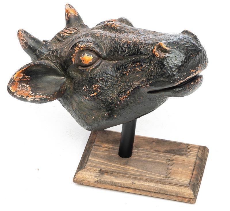 Painted Plaster Cowhead Statue on Wooden Base: 15" tall x 15" wide x 13" deep IN HOUSE SHIPPING AND DELIVERY IS AVAILABLE ON THIS ITEM. Please email shipping@vogtauctio