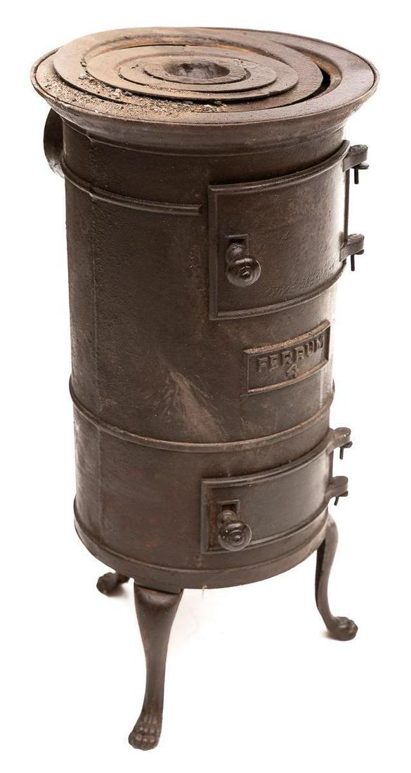 Small Iron "Ferrum" Stove, circa 1900: 22.5" tall x 12" wide STATEWIDE DELIVERY IS AVAILABLE ON THIS ITEM. Please email shipping@vogtauction.com or call 210