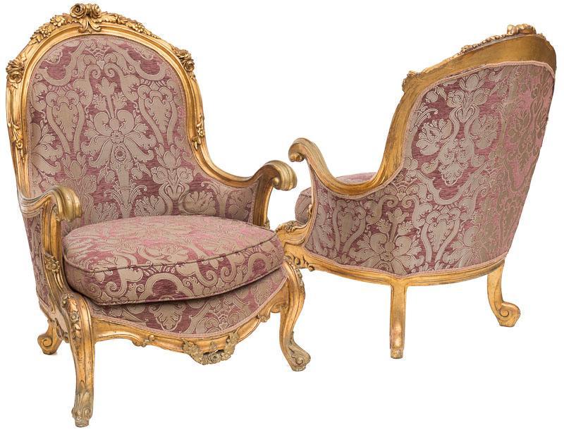 Pair of Bergere Armchairs: Painted gilt accents, lavender upholstery, floral accents 45" tall x 31" wide x 36" deep/ Each Condition: Damage to upholstery trim, stains State-wide delivery is available for this item. Please email