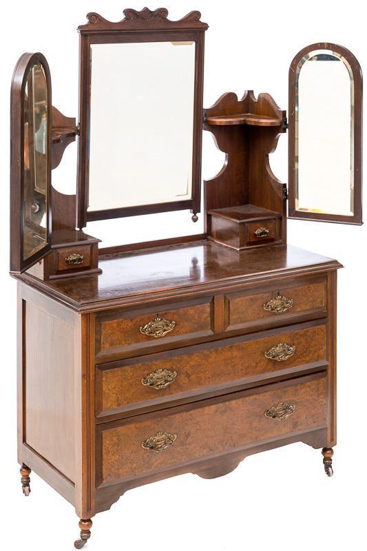 Dressing Table: 2-arched top mirrors, 1-rectangular mirror, 5-drawers, metal drawer pulls, corner cabinets on top, 2-small drawers, mirrors are adjustable, on casters Condition: Scuffs to top 65.5" tall x 42" wide x 