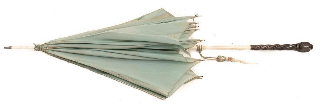 Vintage Lady's Parasol: Sterling silver handle, blue fabric, metal frame Provenance: A New Braunfels, TX Estate 41" long Condition: Ripped fabric