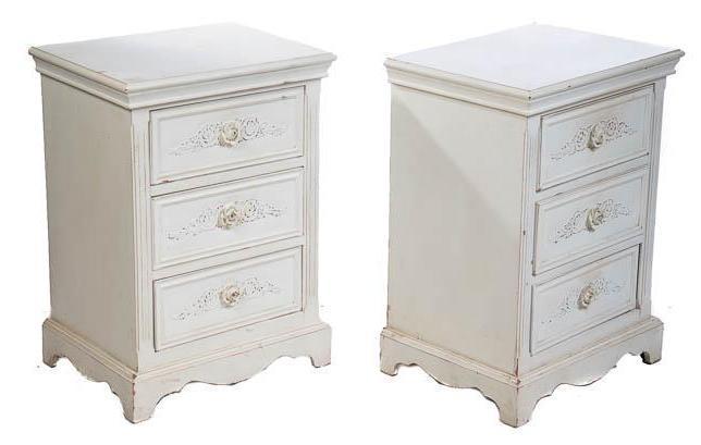 Pair of Nightstands: White painted, floral motif, 3-drawers 27.5" tall x 20" wide x 15" deep Condition: Scuffs State-wide delivery is available for this item. Please email shipping@vogtauction.com or call 210-822-6155 for