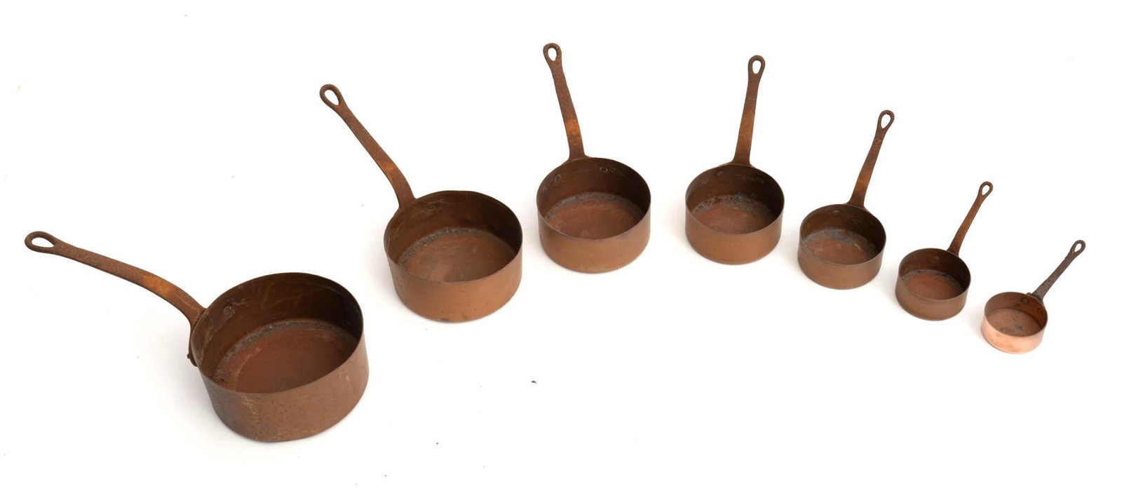 Lot of 7 Copper Pots: Graduated pot set, copper pots with iron handles. Condition: Light abrasions, oxidization 16" long/ Largest