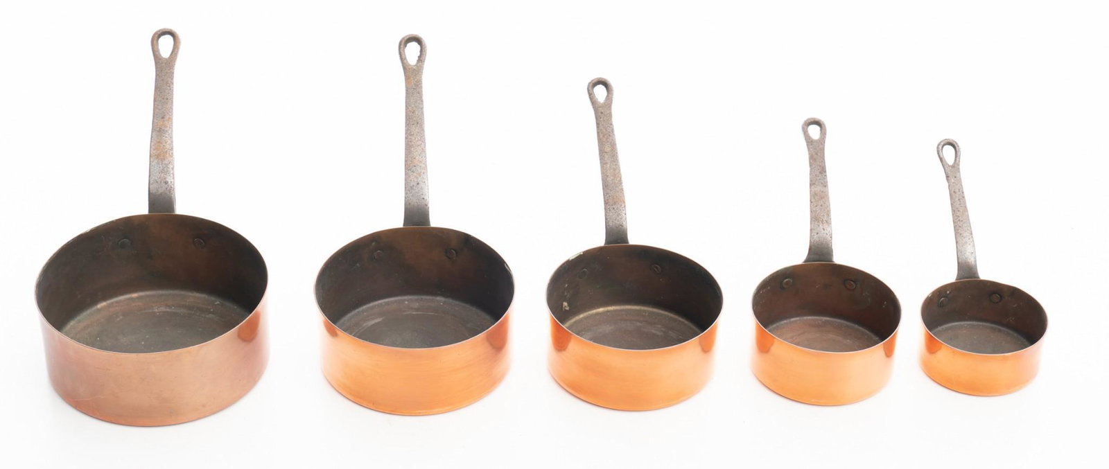 Lot of 5 Copper Pots: Graduated pot set, copper pots with iron handles. Condition: Light abrasions, oxidization 16" long/ Largest
