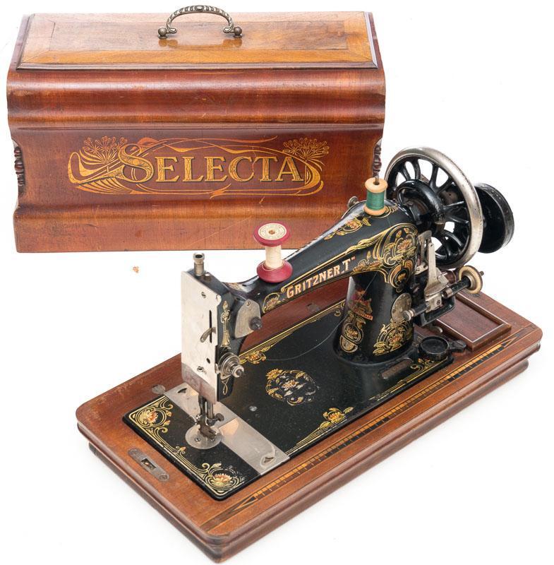Gritzner "T" Sewing Machine: Stamped Gritzner "T", wood base, wood carrying case, metal handle, includes 2 spools 13" tall x 17" wide
