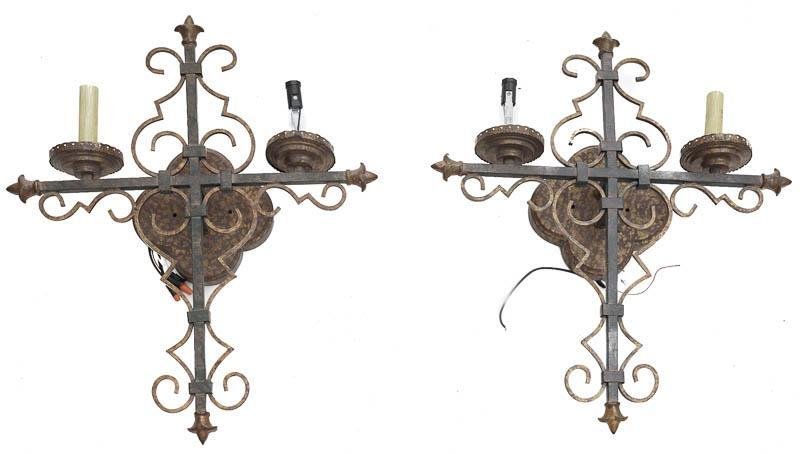 Pair of Wall Sconces: Provenance: The Majestic Theater Penthouse, Downtown San Antonio, Texas Gothic-style, wrought iron, faux candles 21" tall x 16" wide x 4" deep/ Each