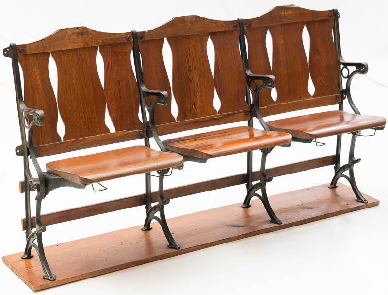 Vintage Theater Seats: Provenance: A Boerne, TX Estate Cast iron frame, wooden backs and seats, seats fold, connected on wooden base 34" tall x 66.5" long x 19" wide State-wide delivery is available for this item. Please em