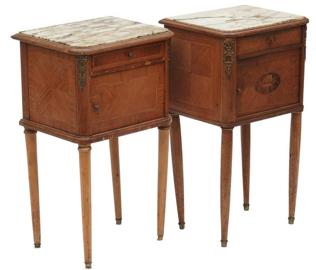 Pair of Marble Top Nightstands: French Provincial-style, white and black marble, metal gilt accents single-door, single-drawer, carved accents 33" tall x 18" wide x 15" deep Condition: Damage to legs State-wide delivery is available