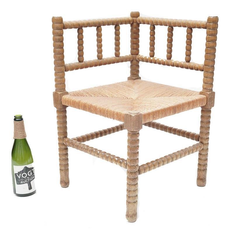 Corner Chair: Petite corner chair, circa 1860, cord seat, turned legs 25.5” tall x 22.5” wide State-wide delivery is available for this item. Please email shipping@vogtauction.com or call 210-822-6155 for a quo