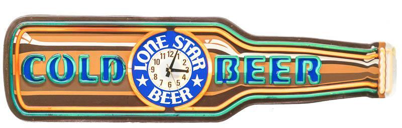 Lone Star Beer Light Up Clock: Provenance: A San Antonio, TX Estate Vintage 1980's Lone Star Beer wall clock, backlight accents 14" tall x 51" wide x 4.5" deep Condition: Small chip State-wide delivery is available for this it
