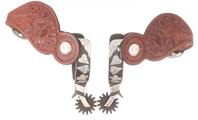 Randy Butters Spurs: Provenance: An Alamo Heights, TX Estate Pair of vintage Randy Butters spurs, leather straps, longhorn and poker motif, stamped R. Butters Homer Mich. no. 961